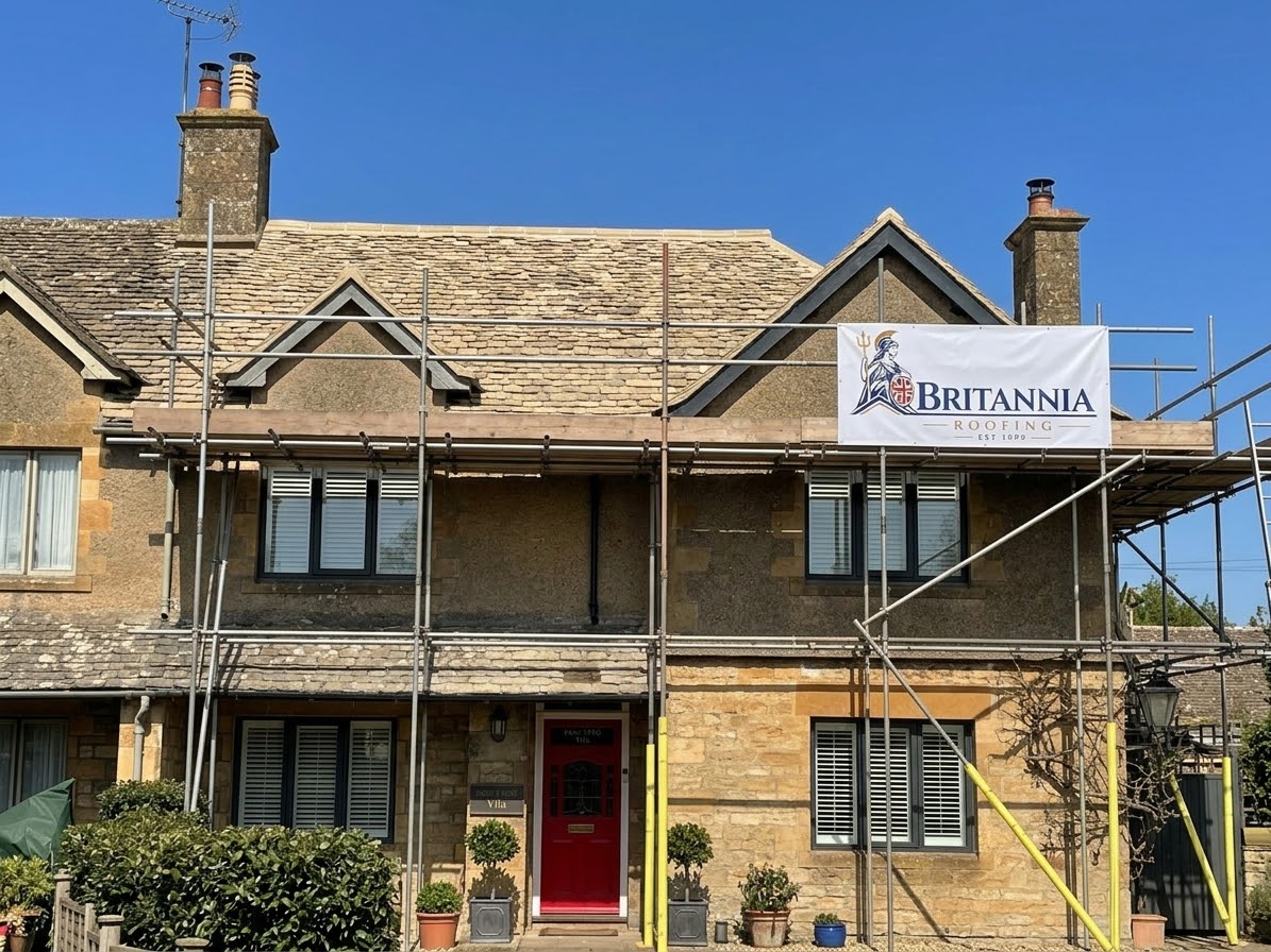 Traditional stone roof and dormers on a Britannia Roofing project