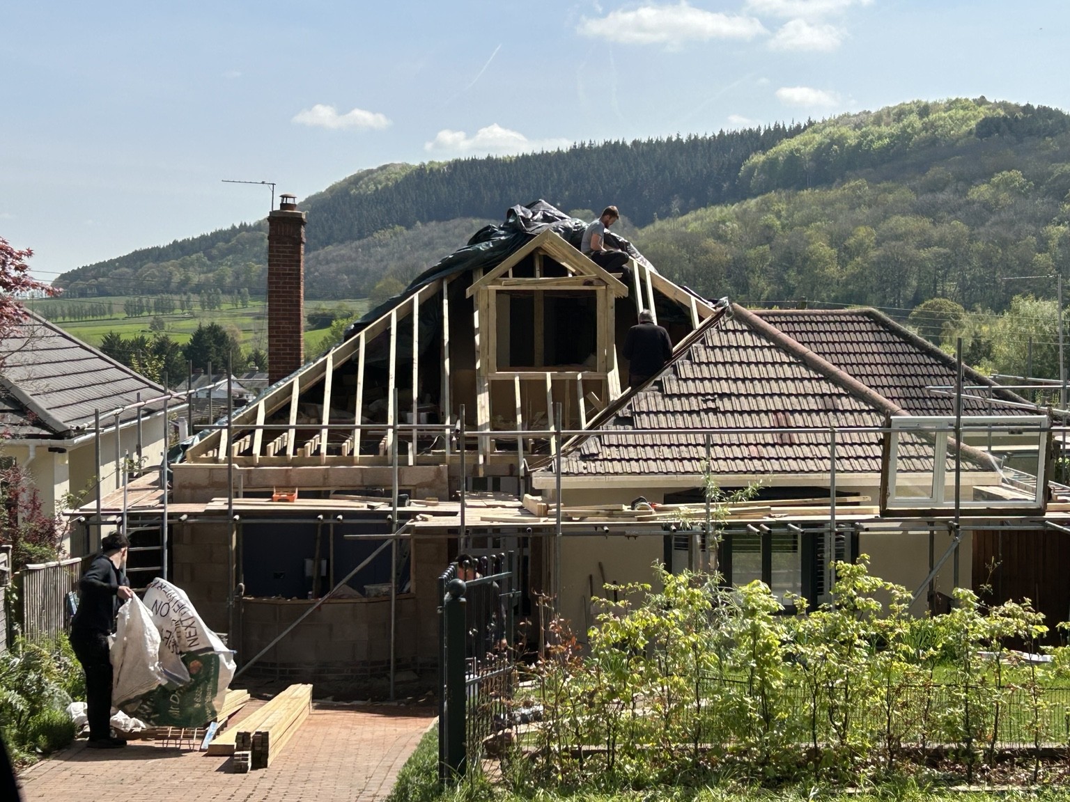 Exposed roof structure around a dormer during roof work