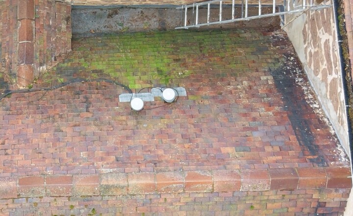 Close-up of tiled roof slopes and a lead valley