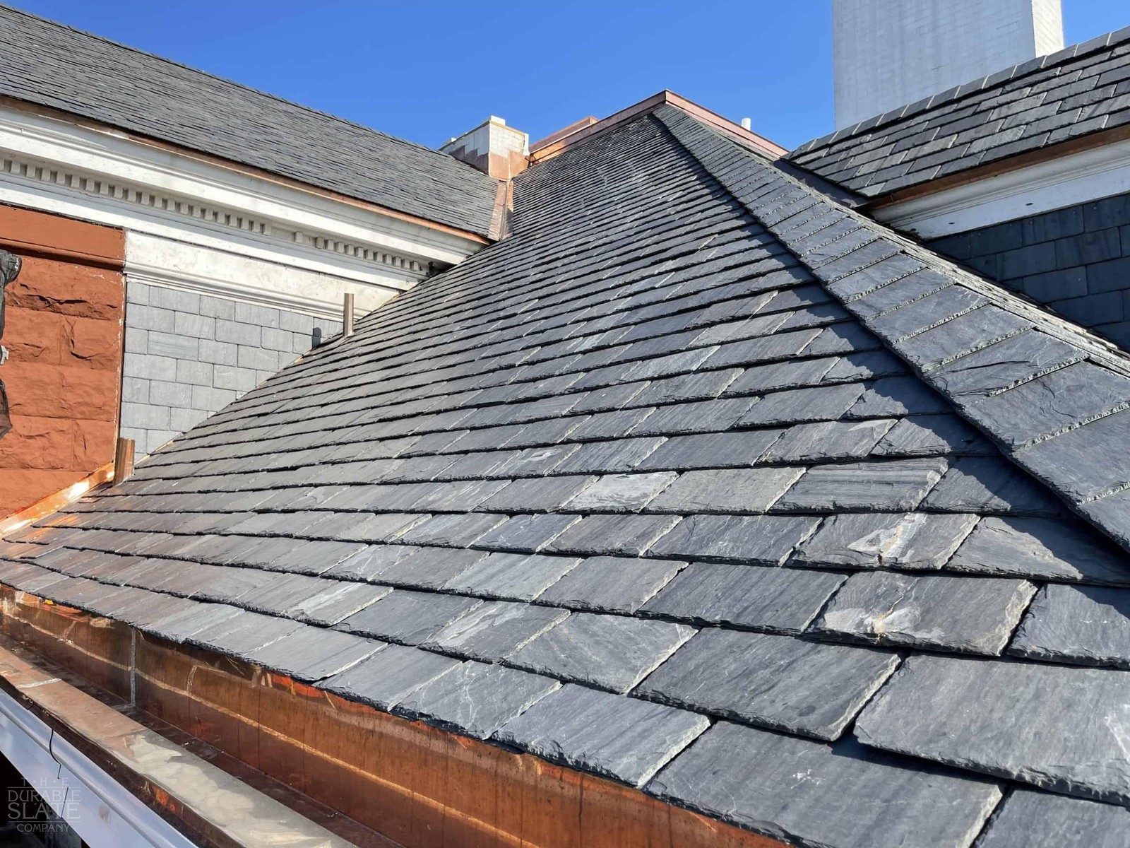 Detail of slate roof courses meeting at a carefully finished hip